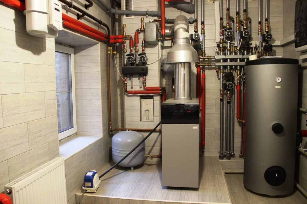 House boiler, water heater, expansion tank and other pipes. newmodern independent heating system in boiler room